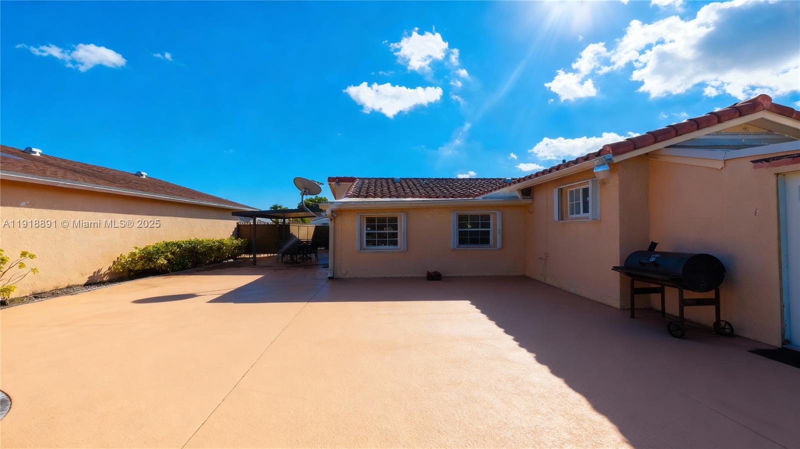 12421 Southwest 193rd Street Miami, FL 33177 - Photo 5 of 23 a view of a house with a patio