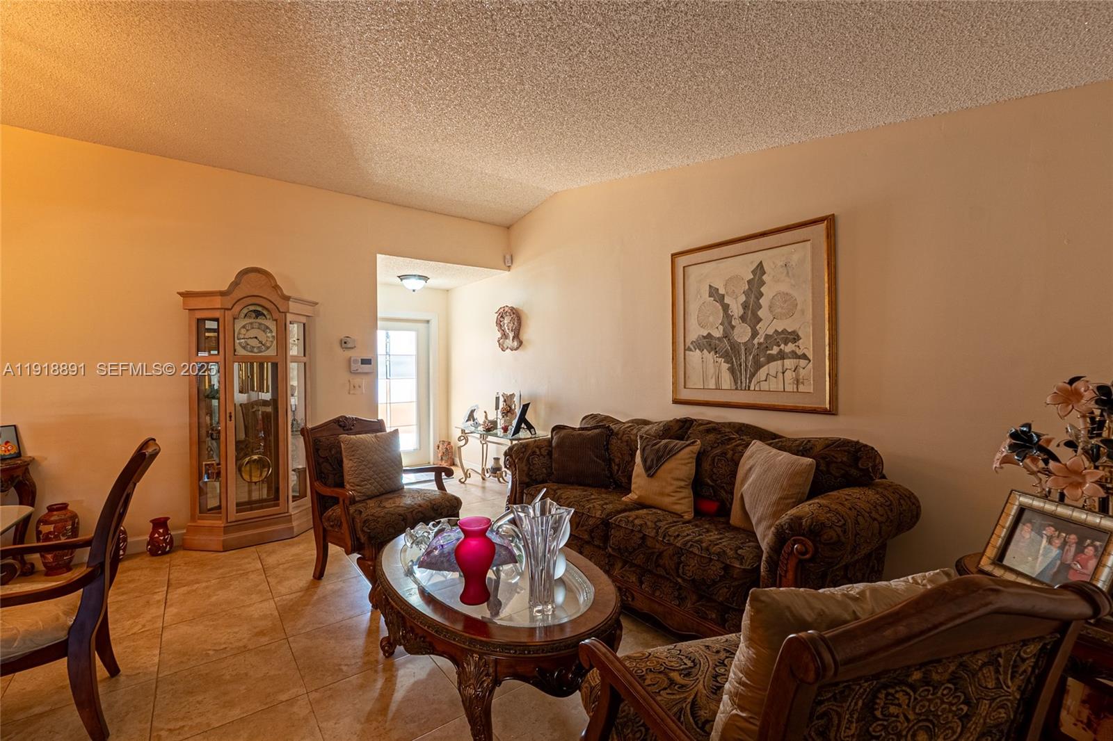 12421 Southwest 193rd Street Miami, FL 33177 - Photo 8 of 23 a living room with furniture and wooden floor