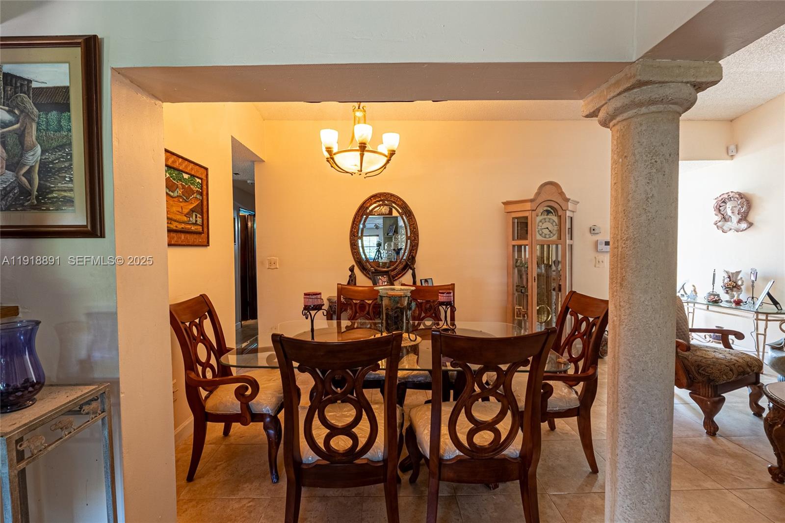 12421 Southwest 193rd Street Miami, FL 33177 - Photo 9 of 23 a view of a dining room with furniture and chandelier