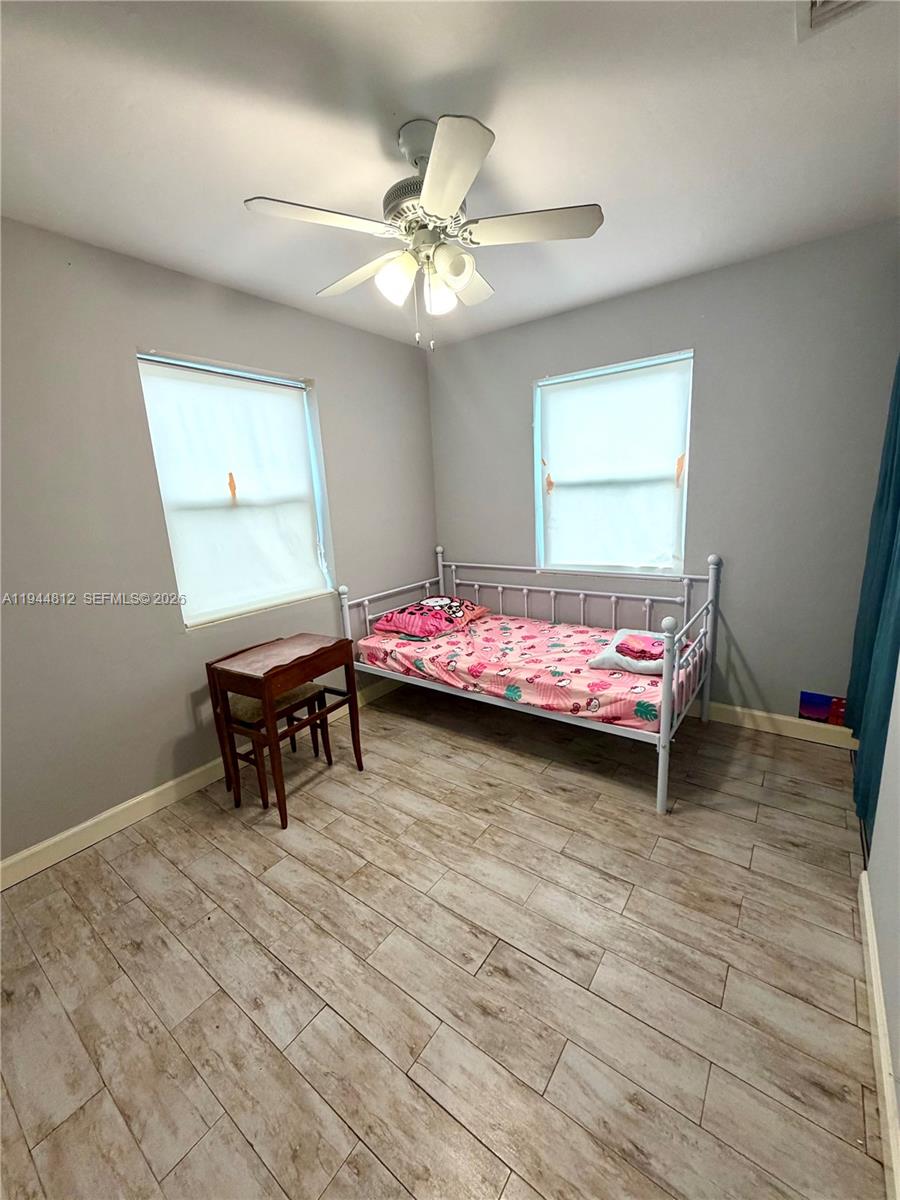 935 Churchill Road West Palm Beach, FL 33405 - Photo 5 of 10 a bedroom with bed and a window