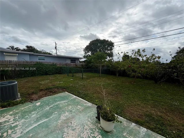 a view of a backyard with plants