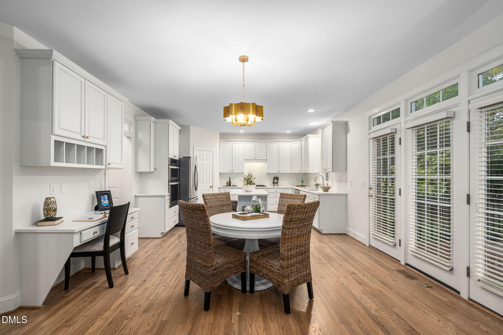 310 Hogans Valley Way Cary, NC 27513 - Photo 16 of 49 a view of a dining room with furniture and a chandelier