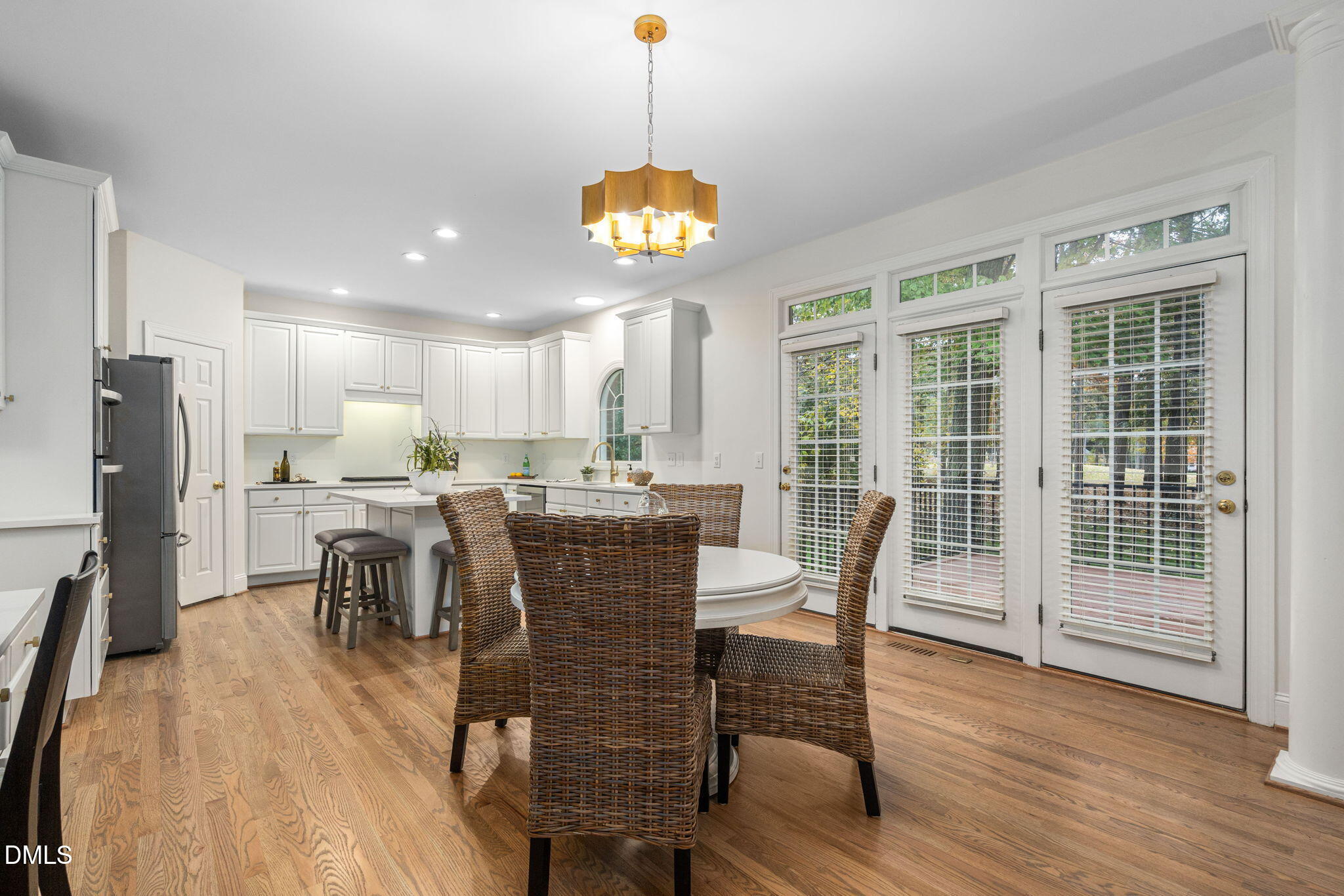 310 Hogans Valley Way Cary, NC 27513 - Photo 17 of 49 a view of a dining room with furniture window and wooden floor