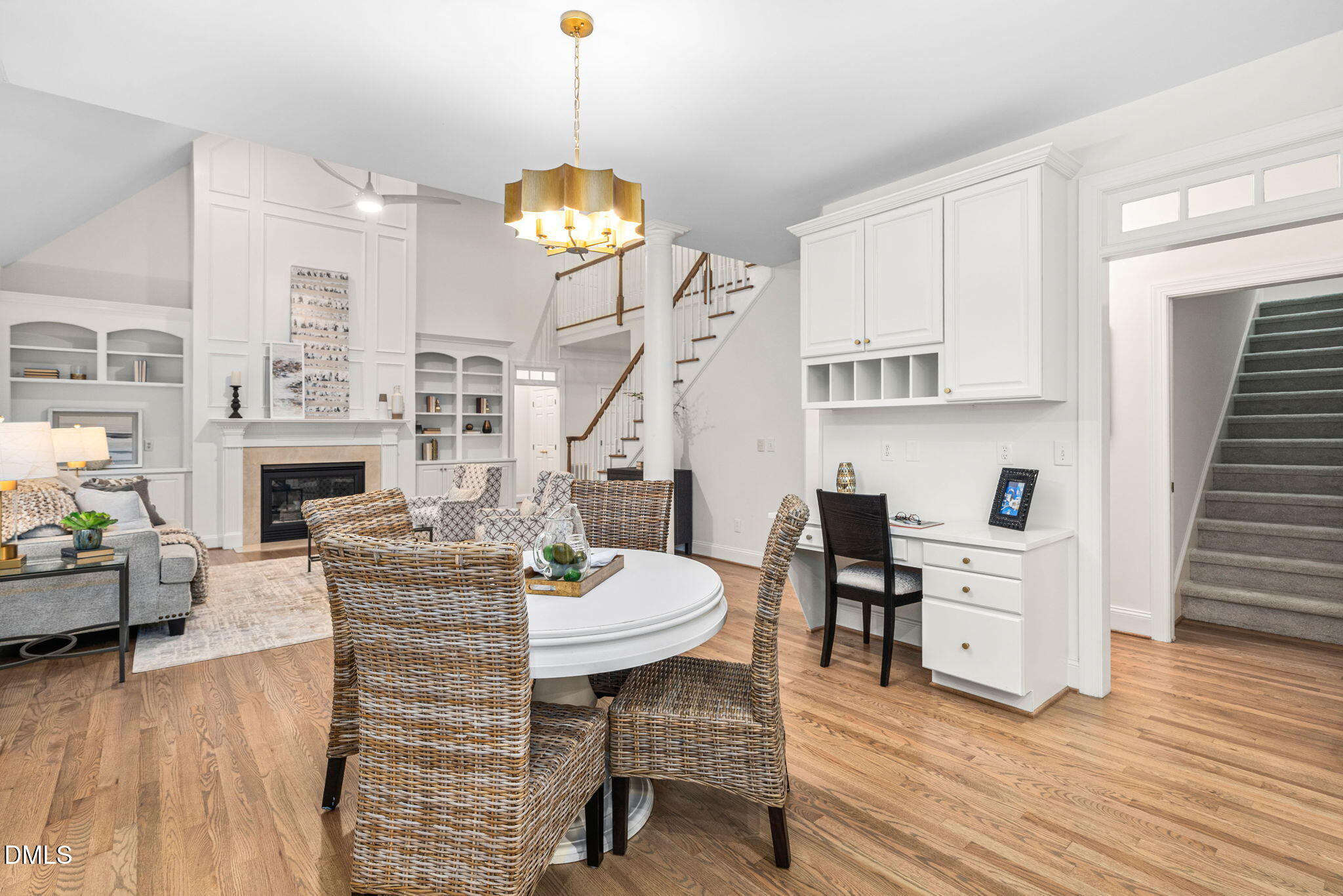 310 Hogans Valley Way Cary, NC 27513 - Photo 22 of 49 a living room with furniture a fireplace and a chandelier