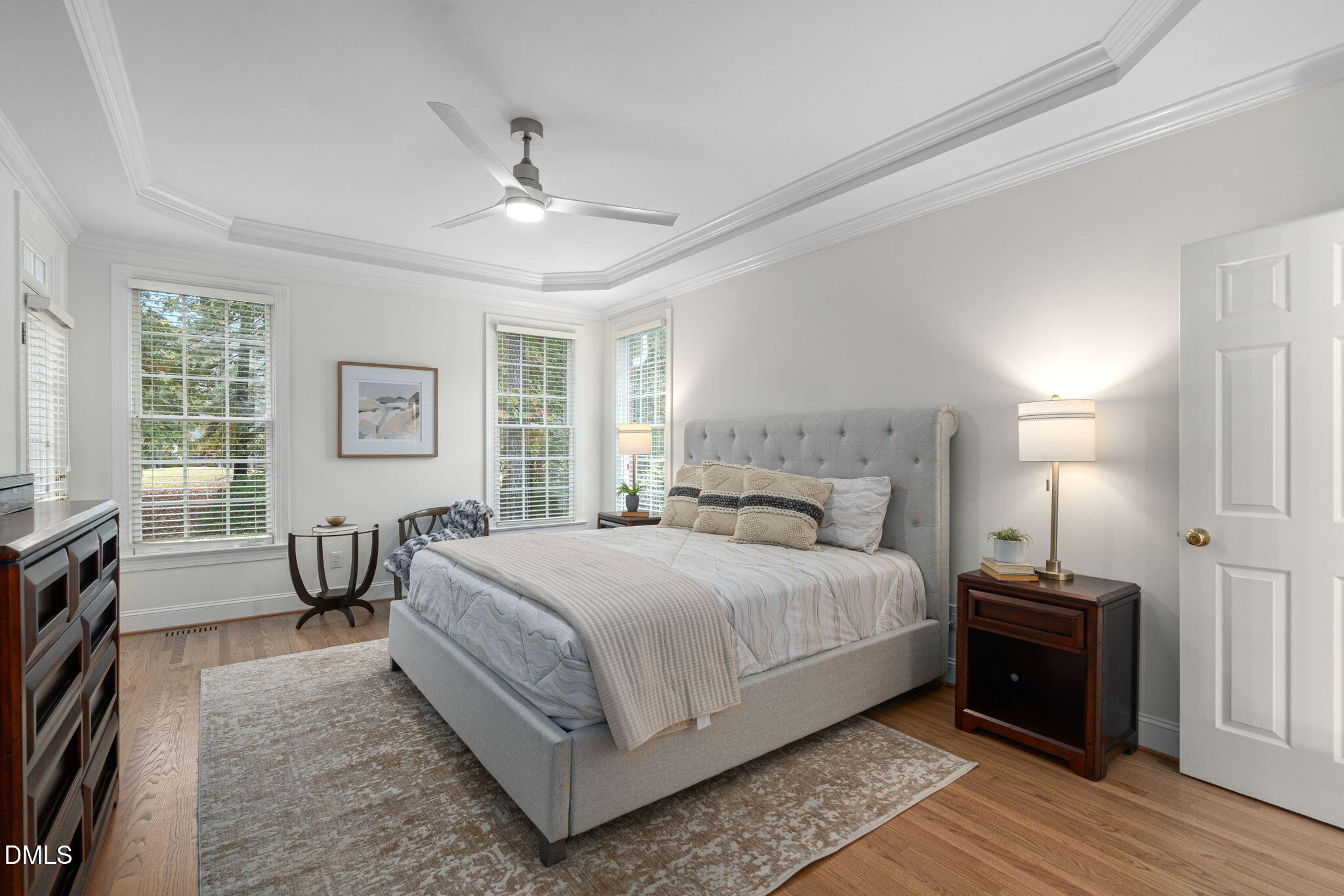 310 Hogans Valley Way Cary, NC 27513 - Photo 26 of 49 a bedroom with a large bed and a chandelier