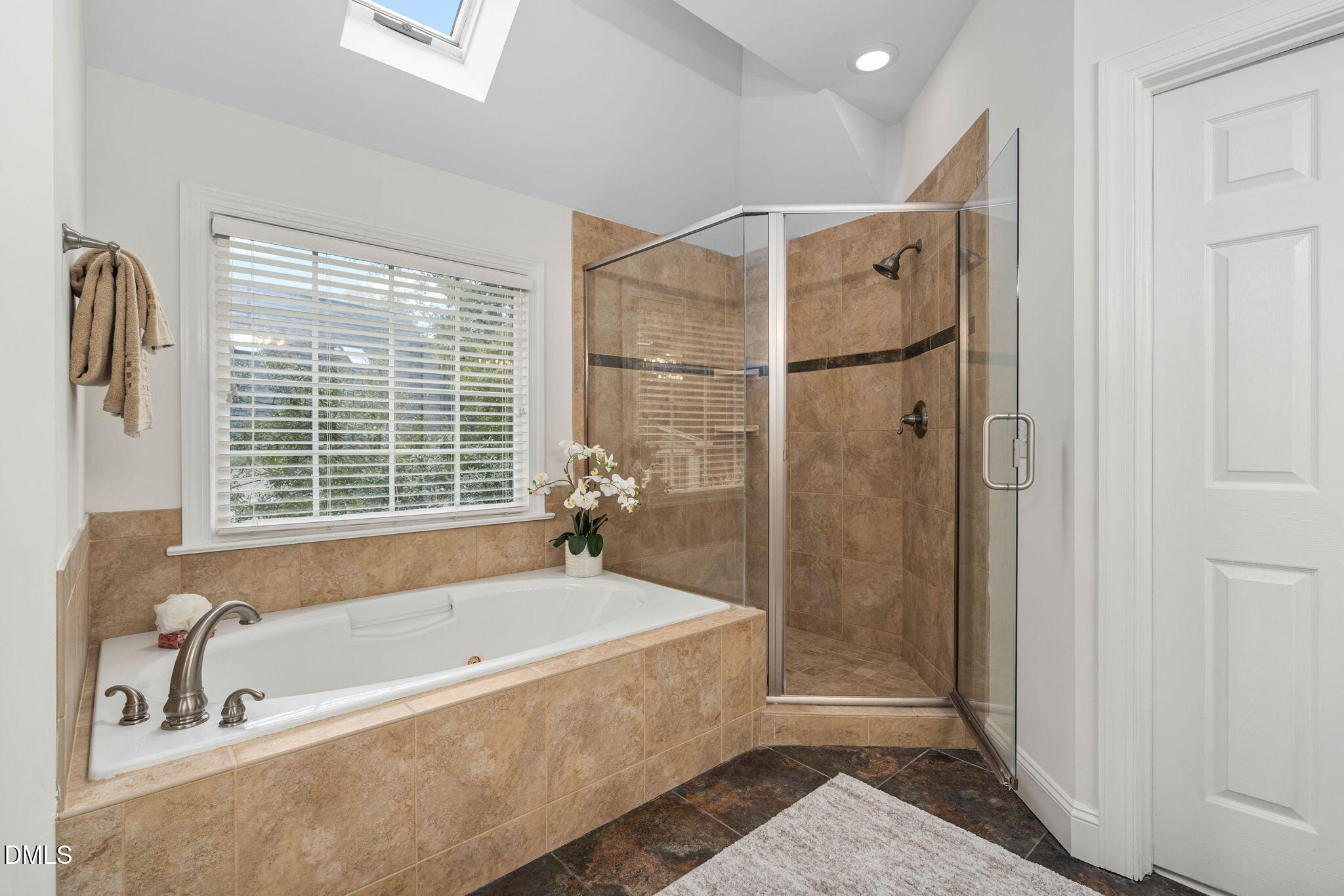 310 Hogans Valley Way Cary, NC 27513 - Photo 30 of 49 a bathroom with a bathtub and a shower