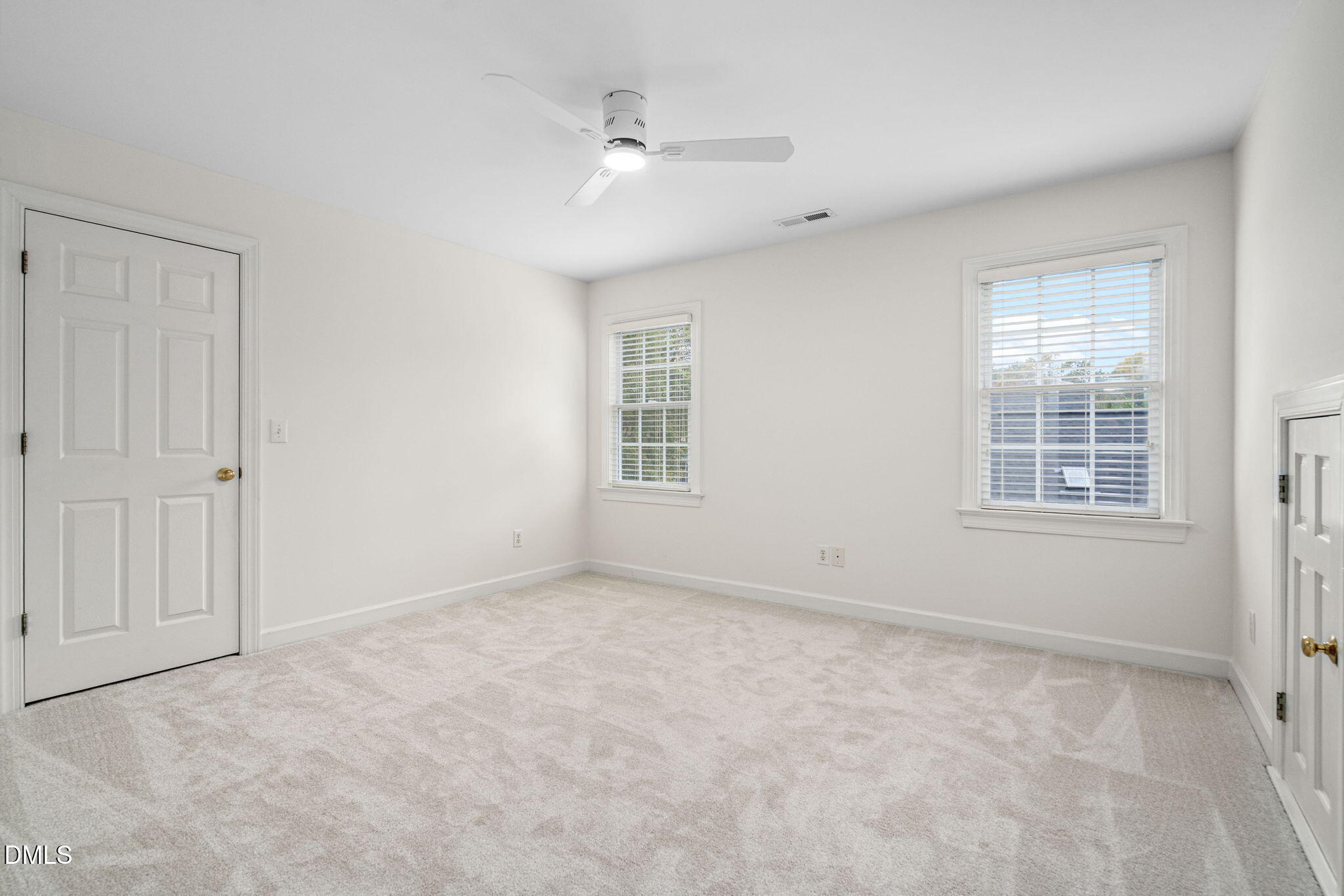 310 Hogans Valley Way Cary, NC 27513 - Photo 46 of 49 an empty room with windows and fan