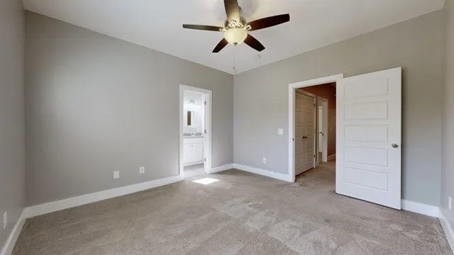 a bathroom with a granite countertop toilet a sink and a bathtub