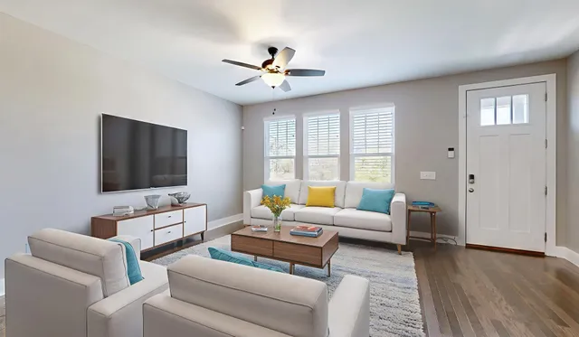 a living room with furniture and a flat screen tv