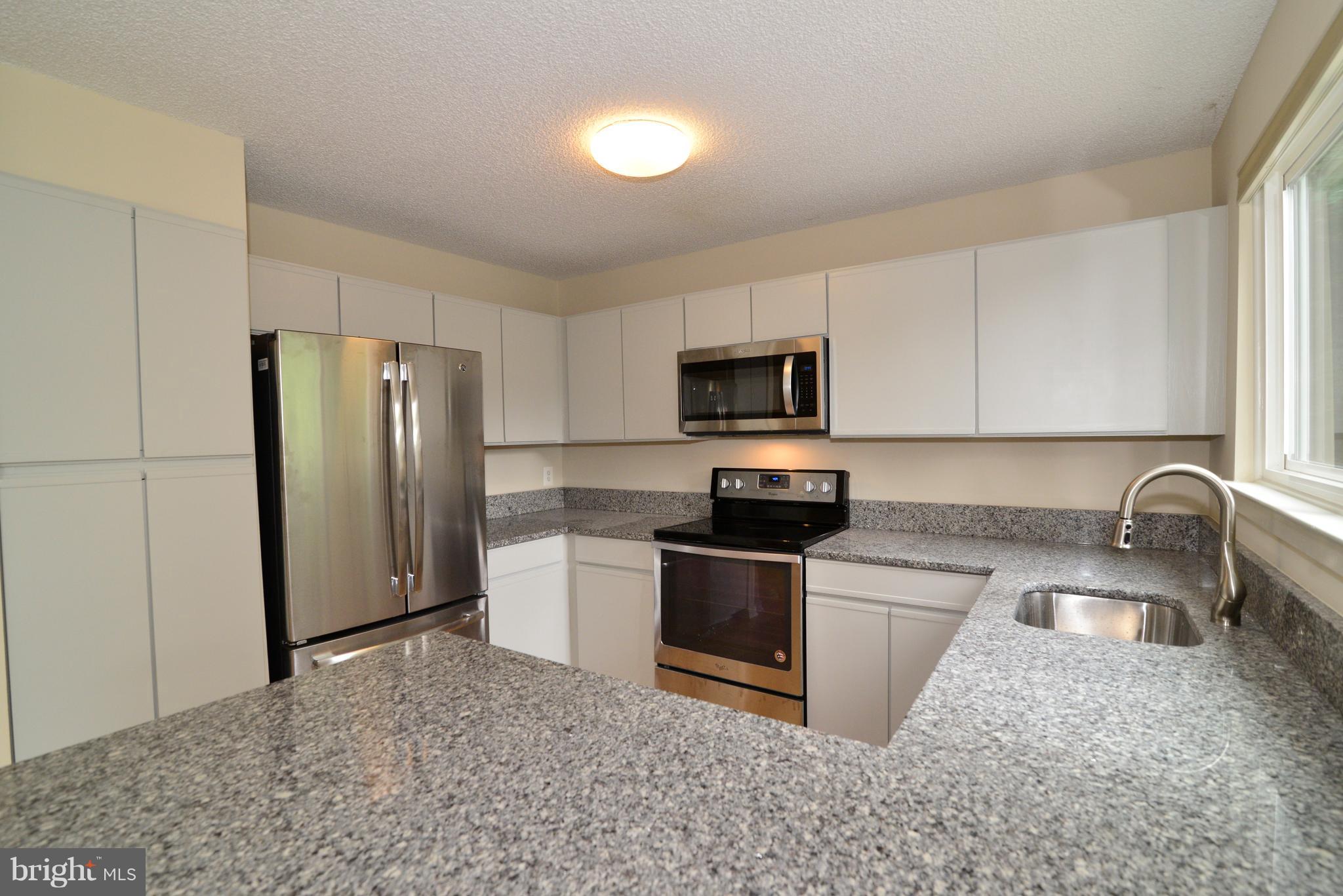 11701 Summerchase Circle, Unit 1701D Reston, VA 20194 - Photo 4 of 18 Freshly painted cabinets