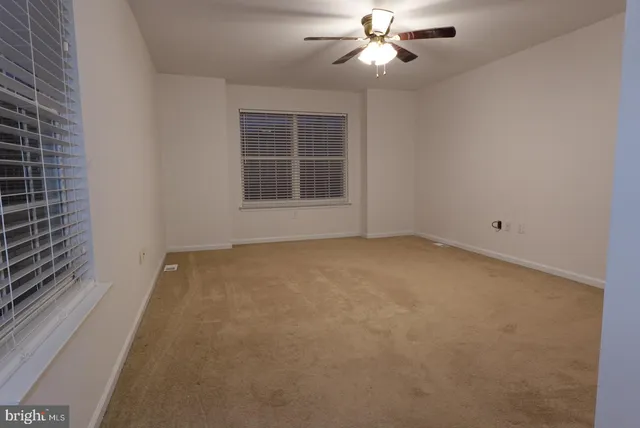 a view of empty room with windows