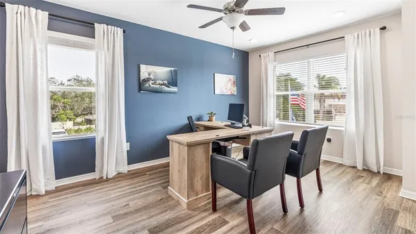 a view of a dining room with furniture window and wooden floor
