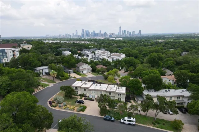 an aerial view of a house with outdoor space
