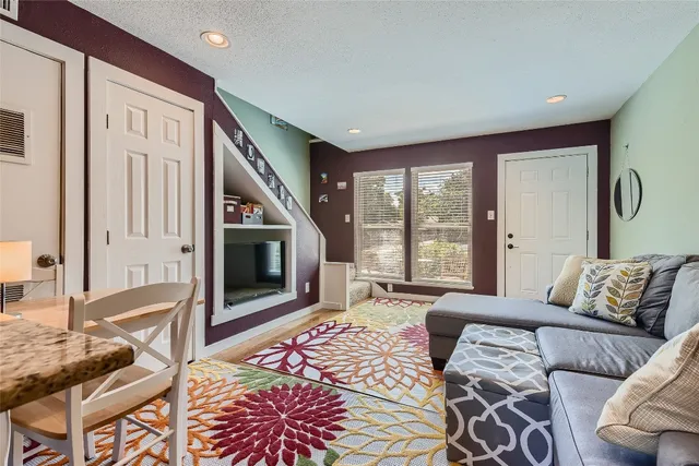 a bedroom with furniture and a fireplace