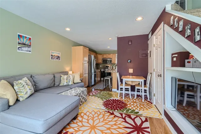 a living room with furniture and a rug