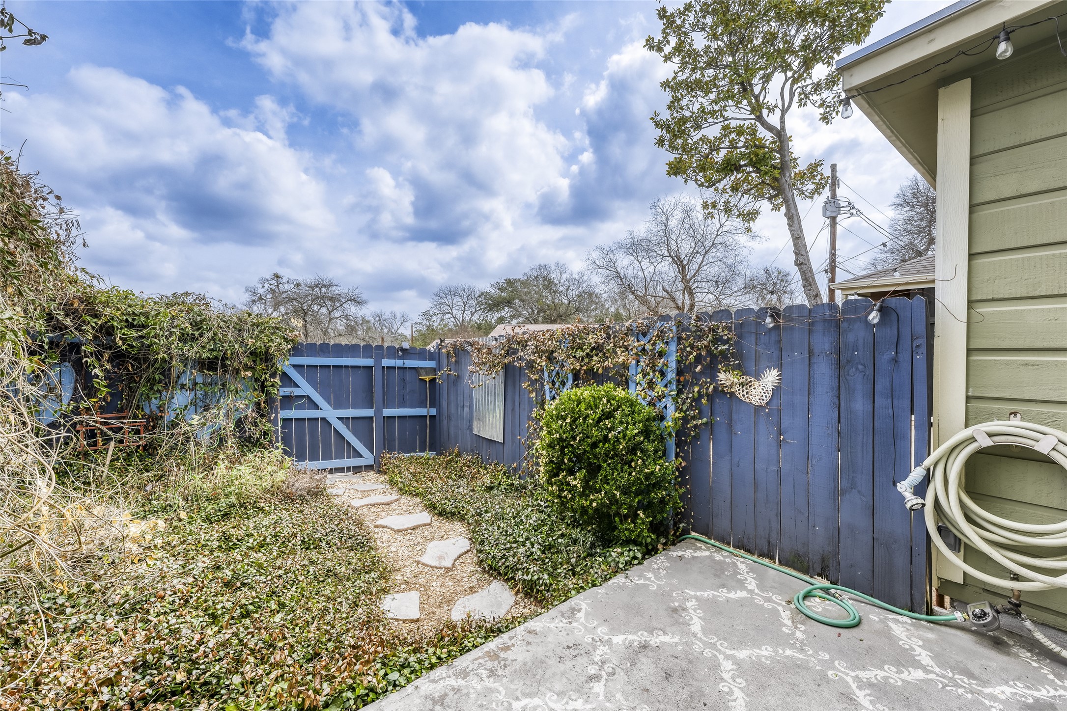 2000 Lightsey Road, Unit 3 Austin, TX 78704 - Photo 8 of 28 Private fenced patio with a gate leading to assigned parking space.