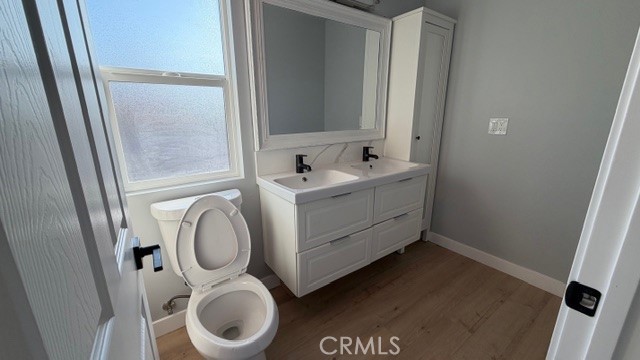 2413 La Crescenta Avenue, Unit A Alhambra, CA 91803 - Photo 9 of 11 a bathroom with a toilet sink and mirror