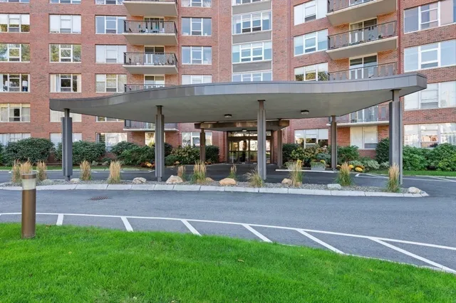 a view of a building with a yard