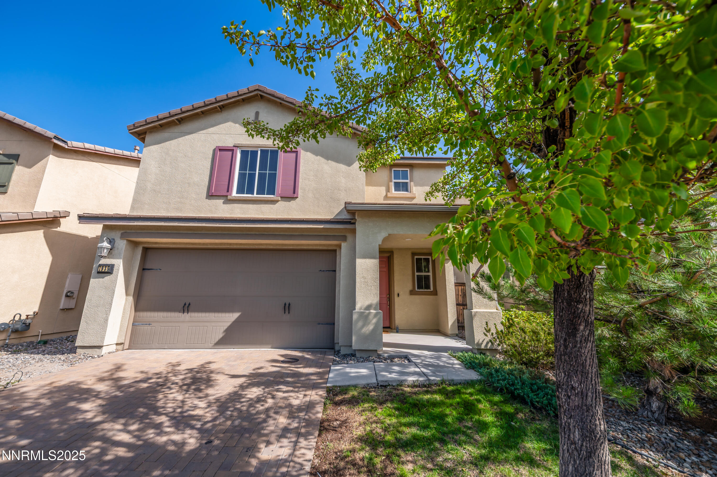1935 Glacier Meadow Drive Reno, NV 89521 - Photo 1 of 20 a front view of a house with a garden
