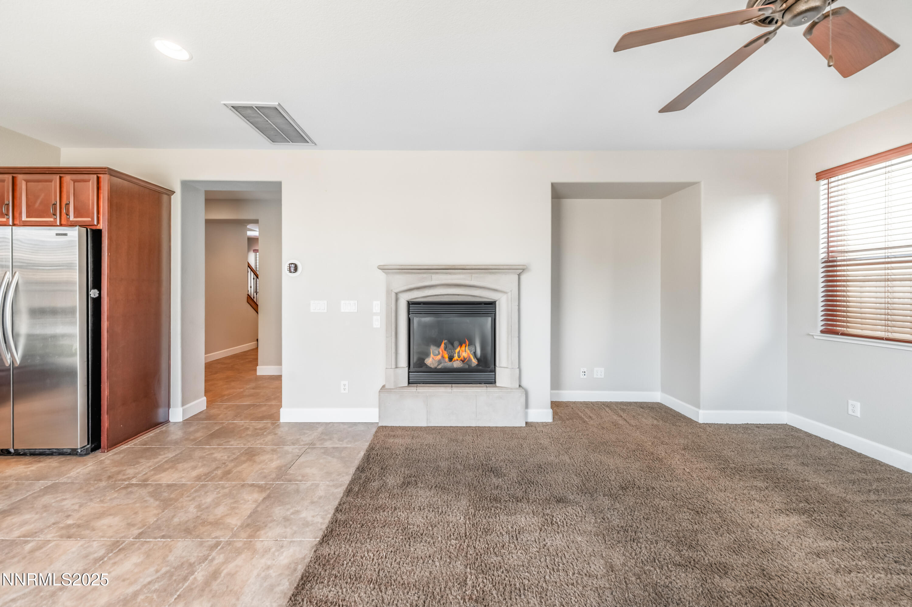 1935 Glacier Meadow Drive Reno, NV 89521 - Photo 12 of 20 a view of an empty room with a window and fireplace