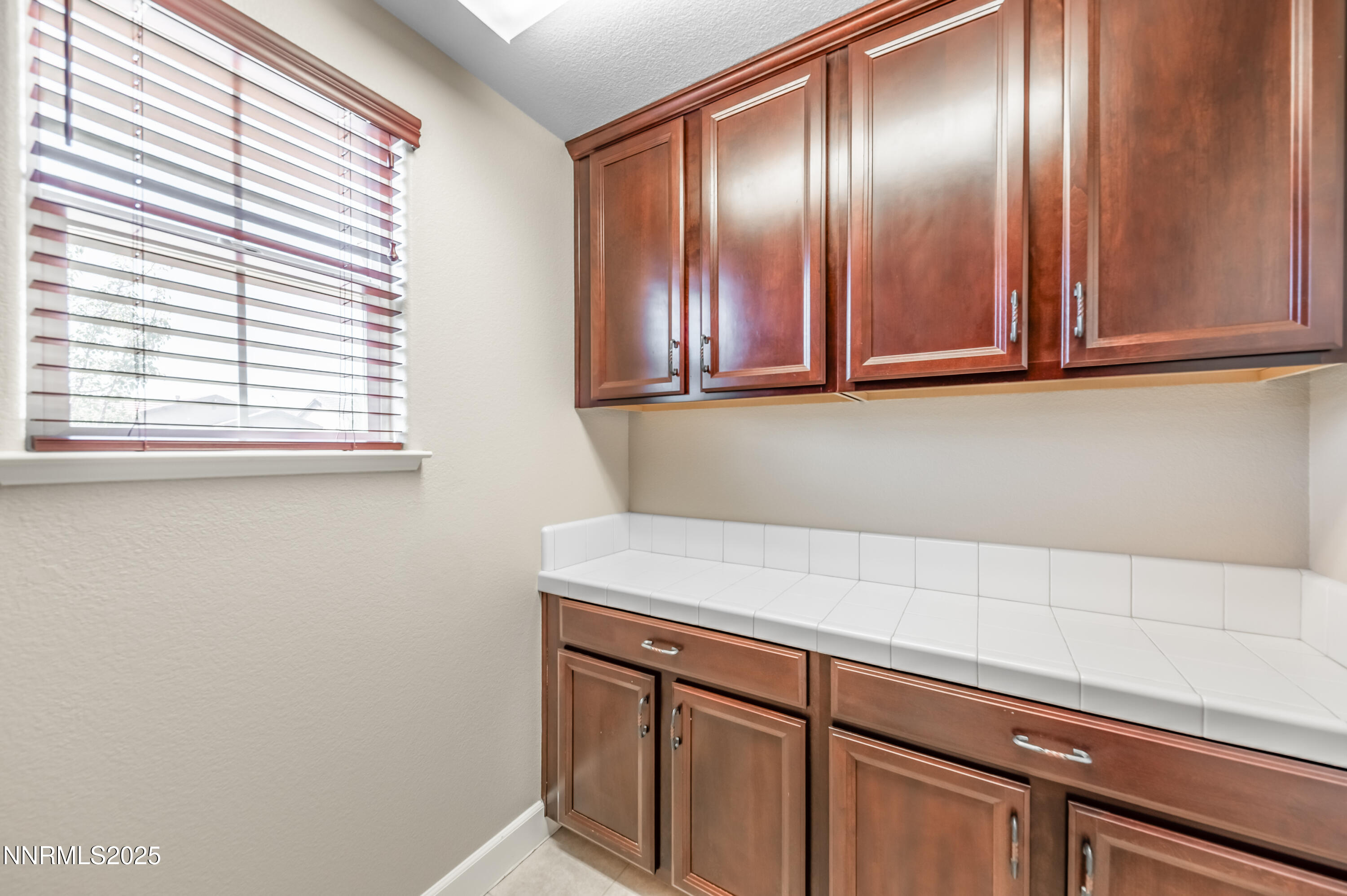 1935 Glacier Meadow Drive Reno, NV 89521 - Photo 16 of 20 a view of a kitchen with wooden cabinets
