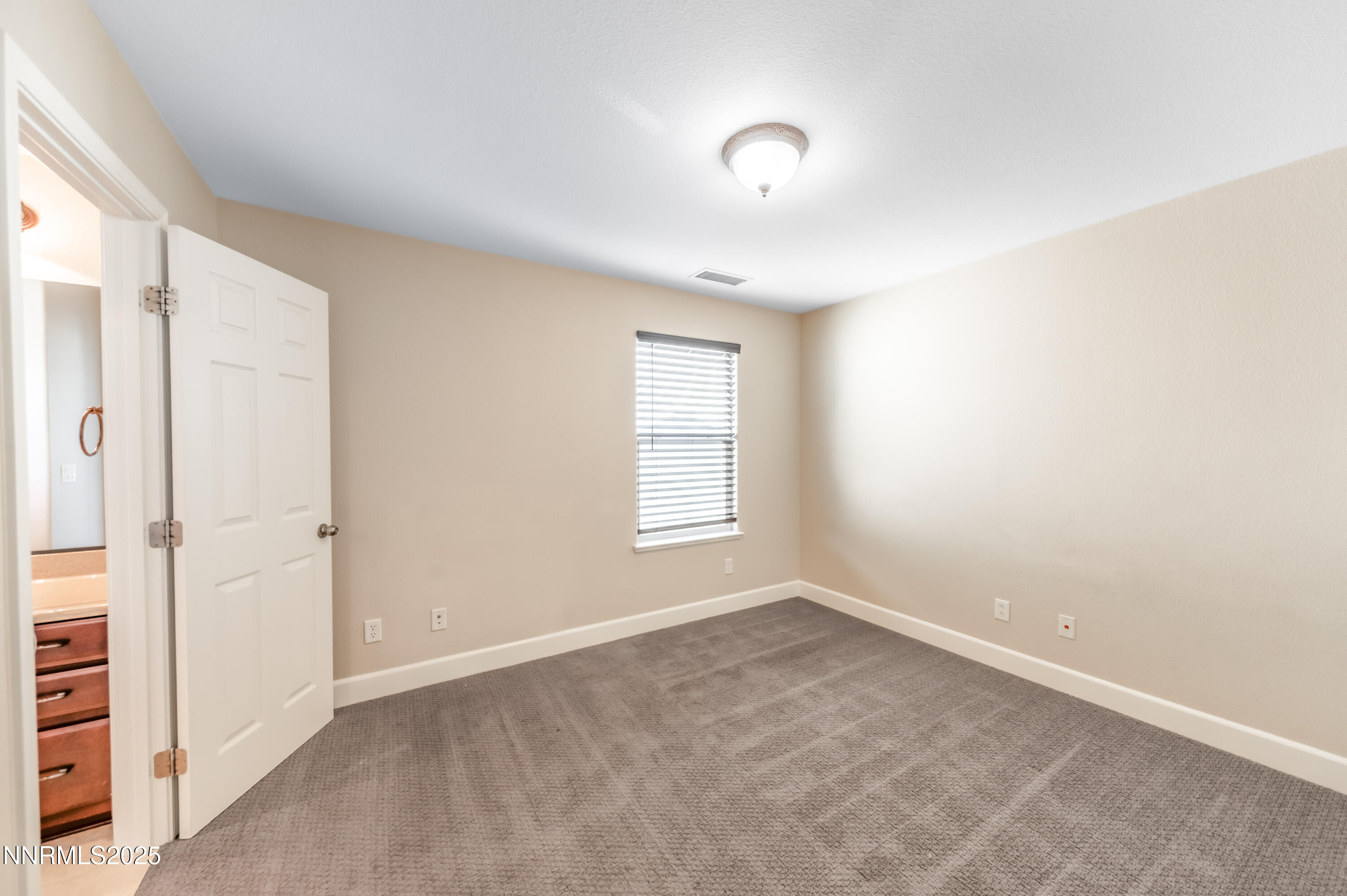 1935 Glacier Meadow Drive Reno, NV 89521 - Photo 18 of 20 an empty room with windows