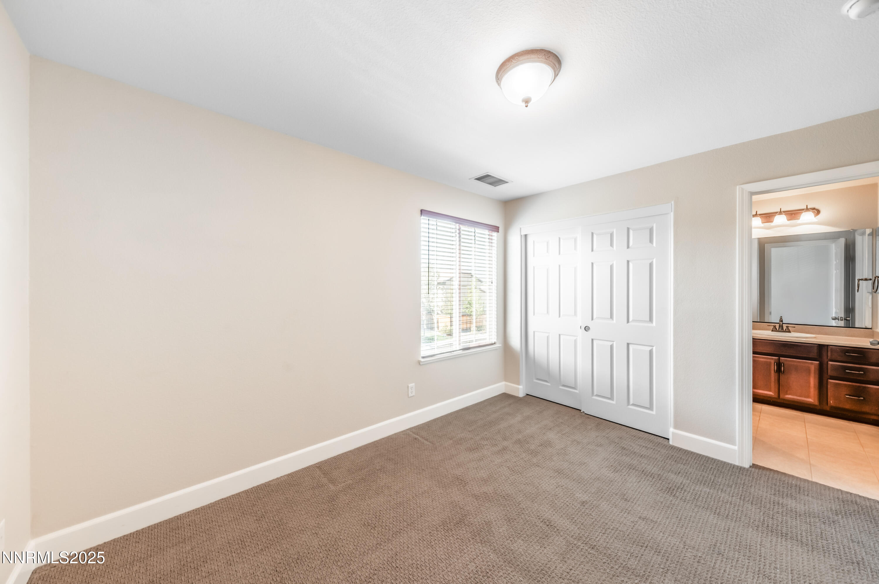 1935 Glacier Meadow Drive Reno, NV 89521 - Photo 19 of 20 a view of an empty room with a window