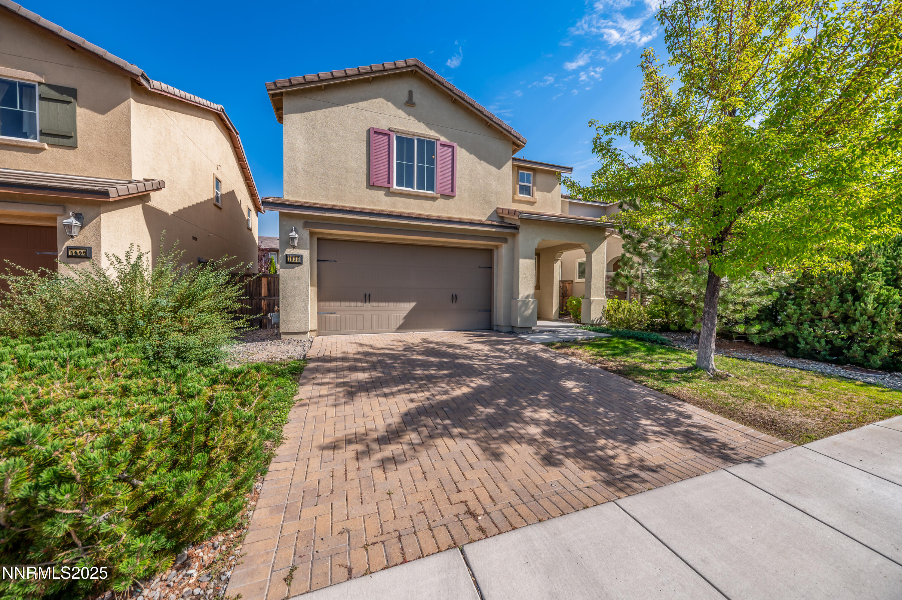 1935 Glacier Meadow Drive Reno, NV 89521 - Photo 2 of 20 a front view of a house with garden