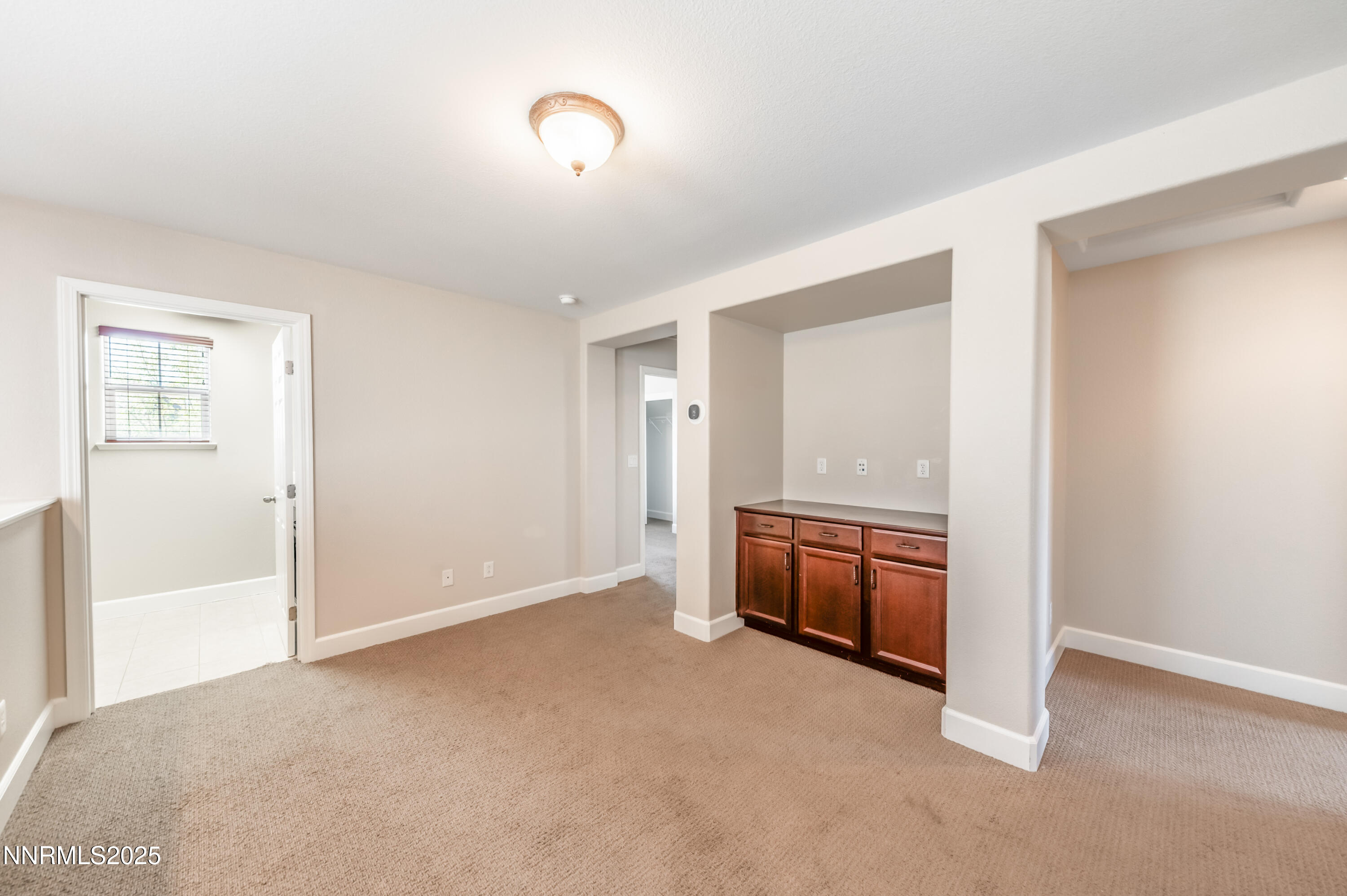 1935 Glacier Meadow Drive Reno, NV 89521 - Photo 6 of 20 a view of an empty room with a window