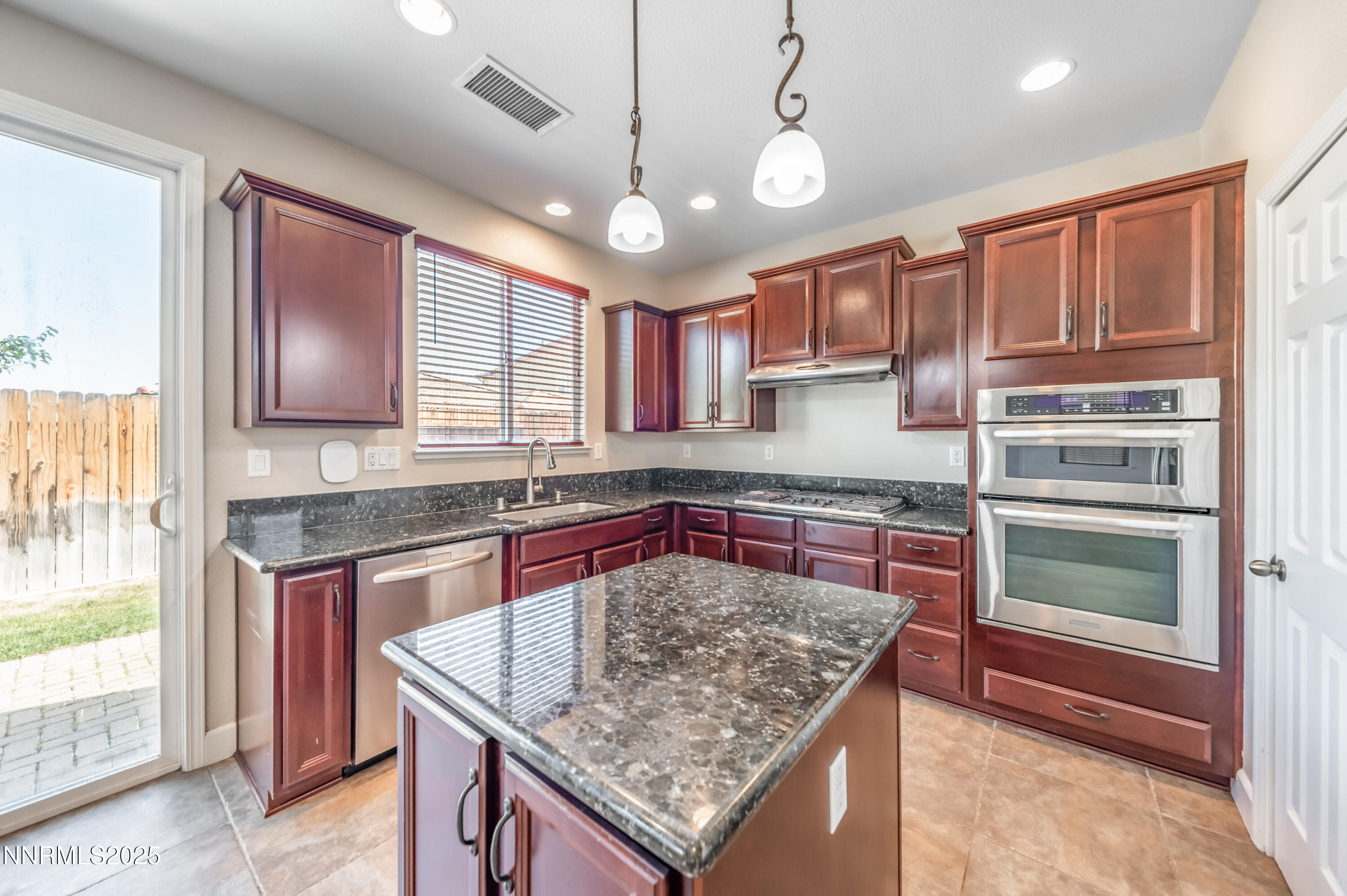1935 Glacier Meadow Drive Reno, NV 89521 - Photo 9 of 20 a kitchen with stainless steel appliances granite countertop a granite counter tops and a window
