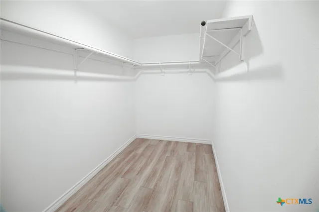 a view of a room with racks on the wall