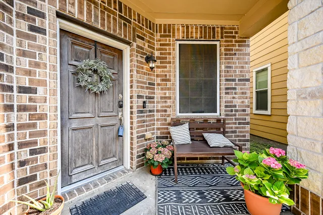 a front view of a house with a garden