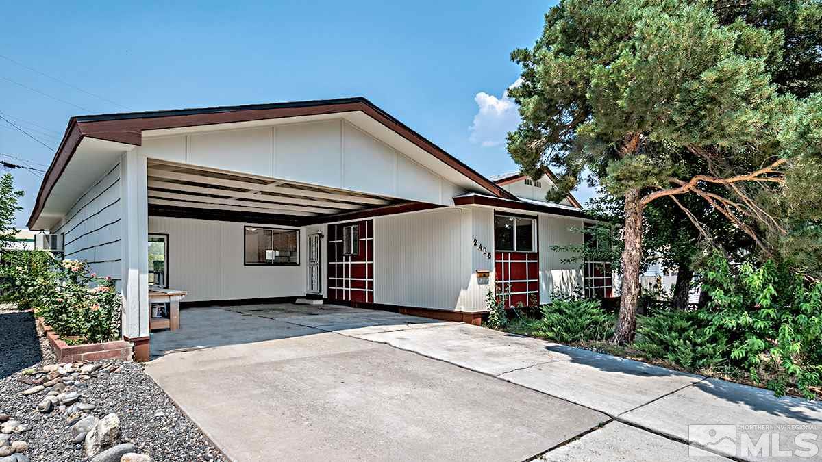 2435 Apollo Way Reno, NV 89503 - Photo 1 of 1 a view of a house with a yard and potted plants