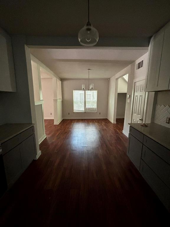 2505 May Street Fort Worth, TX 76110 - Photo 15 of 19 a view of empty room with wooden floor and fan