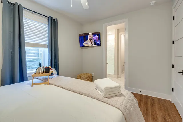 a bedroom with a bed and a window