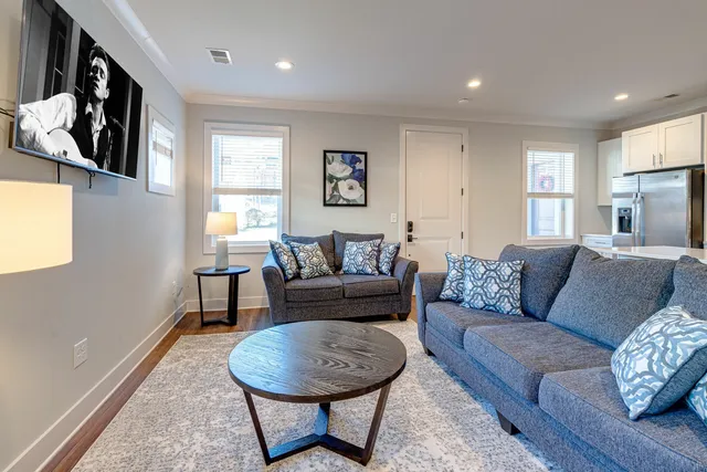 a living room with furniture and a window