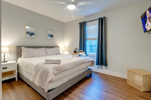 a bedroom with a bed and a window