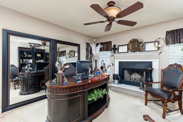 a living room with furniture and a fireplace