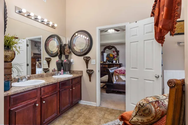 a living room with furniture and a mirror