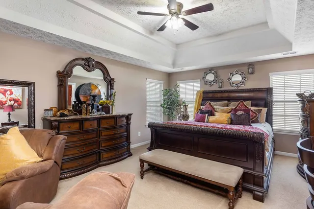 a bed room with furniture and a chandelier