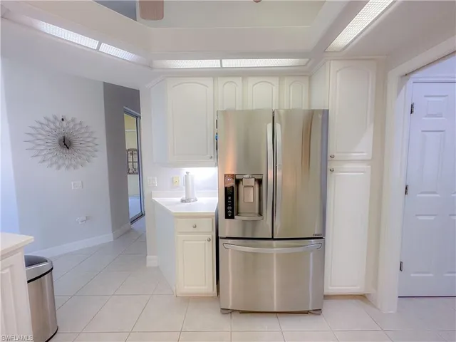 a refrigerator freezer sitting in a kitchen