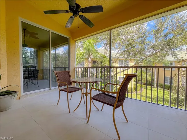 a view of a chairs and table in a patio