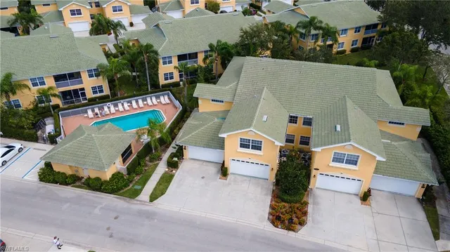 an aerial view of multiple houses with outdoor space