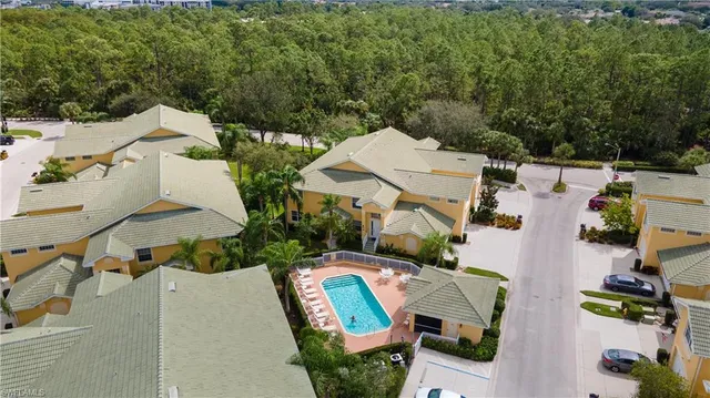 an aerial view of a house with outdoor space