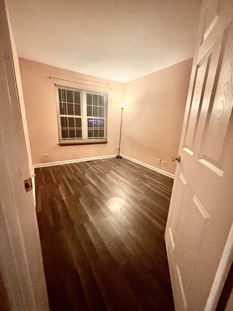 613 Sutton Court Wheeling, IL 60090 - Photo 17 of 36 a view of an empty room with a window