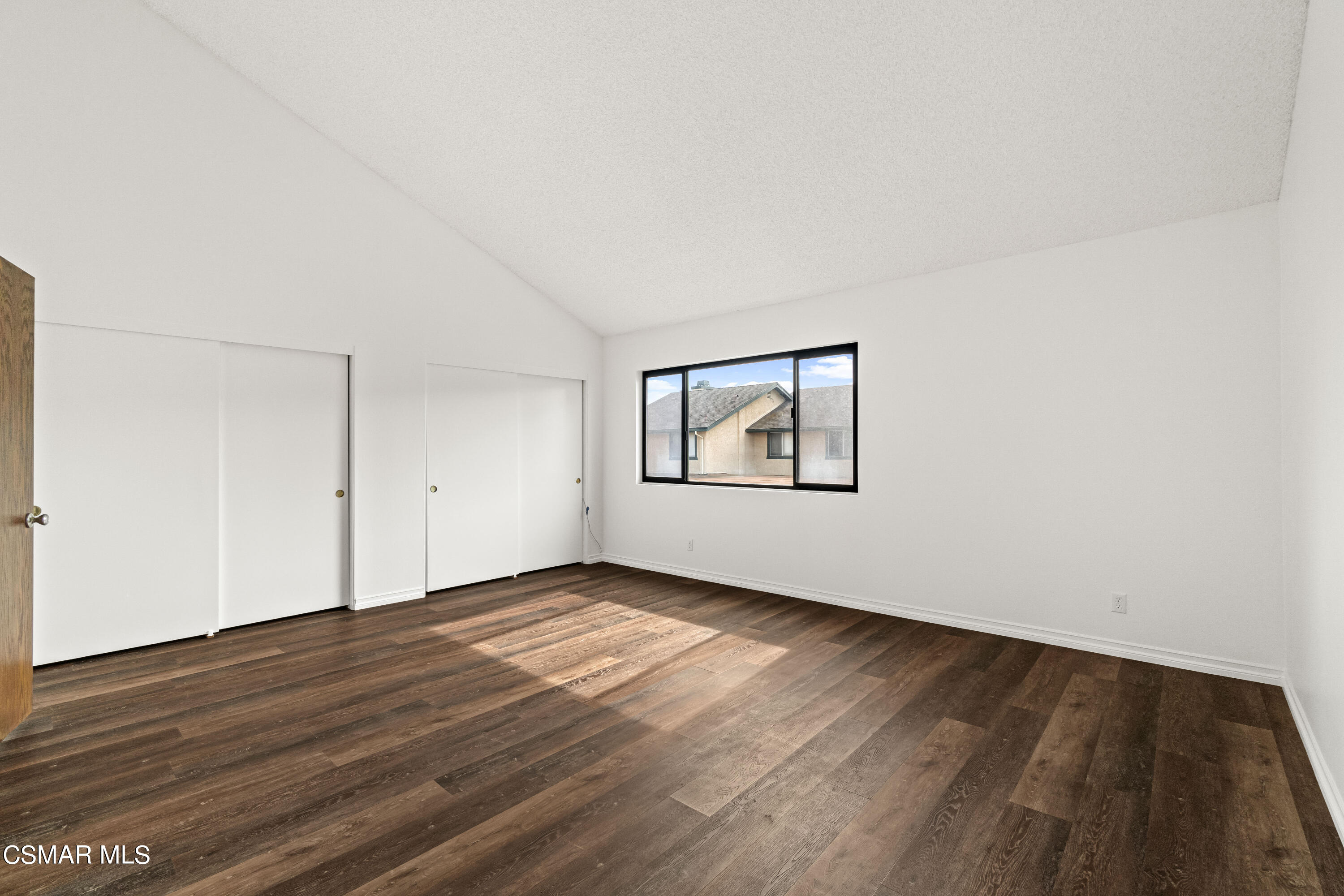 5133 Perkins Road Oxnard, CA 93033 - Photo 19 of 30 an empty room with wooden floor and windows