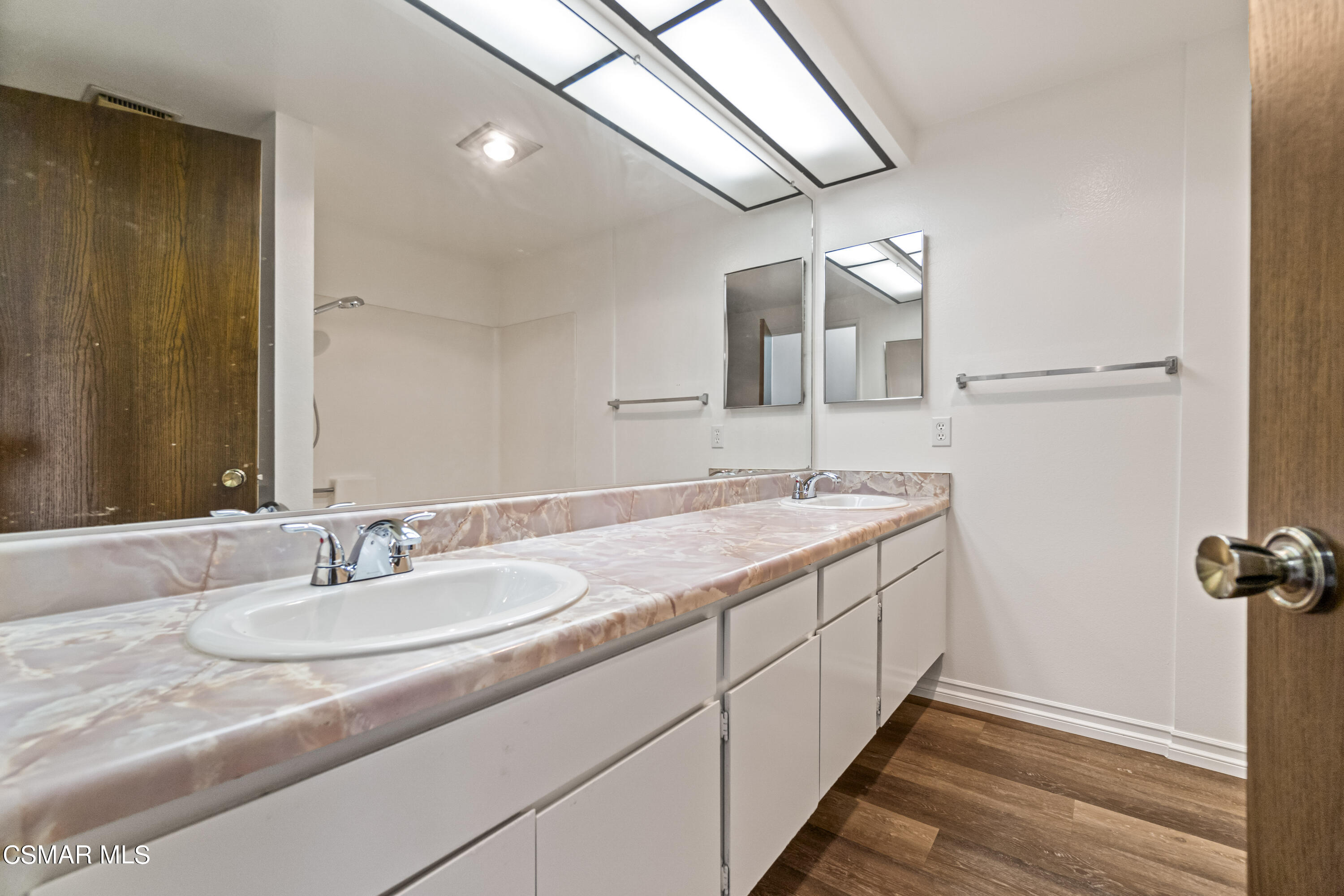 5133 Perkins Road Oxnard, CA 93033 - Photo 20 of 30 a bathroom with a sink and a mirror