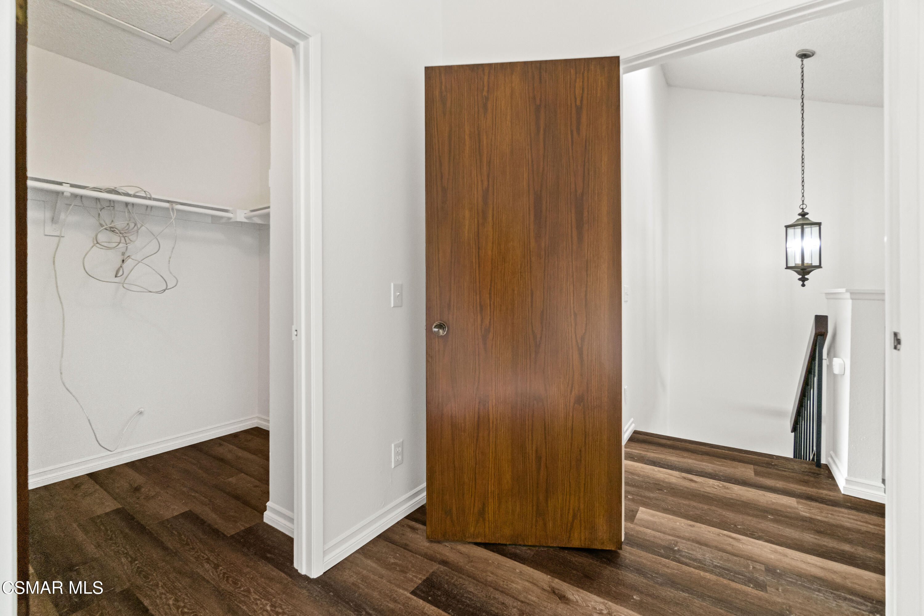 5133 Perkins Road Oxnard, CA 93033 - Photo 23 of 30 a view of a hallway with wooden floor and staircase