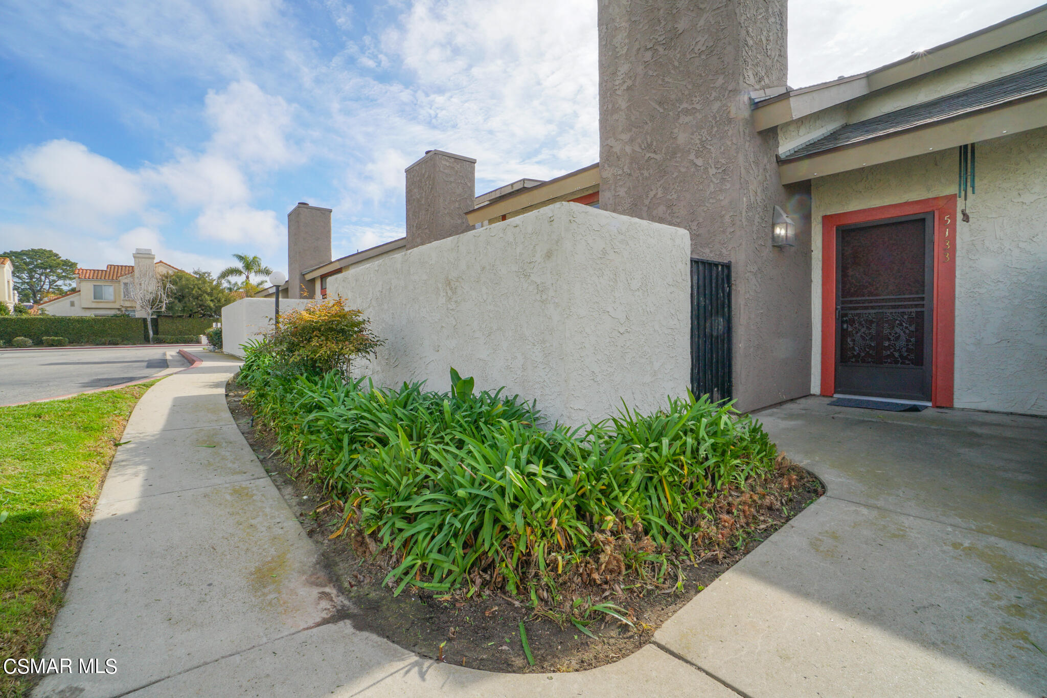 5133 Perkins Road Oxnard, CA 93033 - Photo 3 of 30 a view of a pathway both side of the house