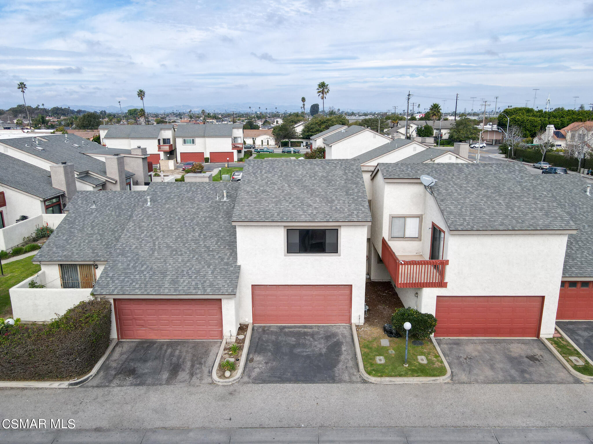 5133 Perkins Road Oxnard, CA 93033 - Photo 4 of 30 a front view of a house with a yard and street